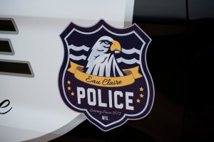 The elements of the logo are seen here, with the water in the background representing Eau Claire, the eagle, and the six stars representing the Eau Claire Police Departments core values.